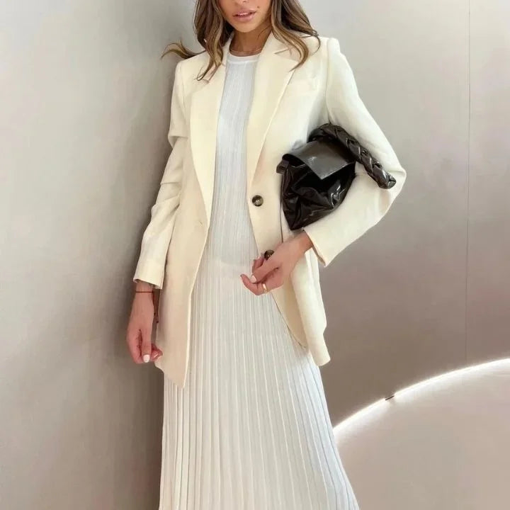 Women's sleeveless A-line maxi dress with pleated design, made from lightweight fabric for a comfortable, flowy fit.