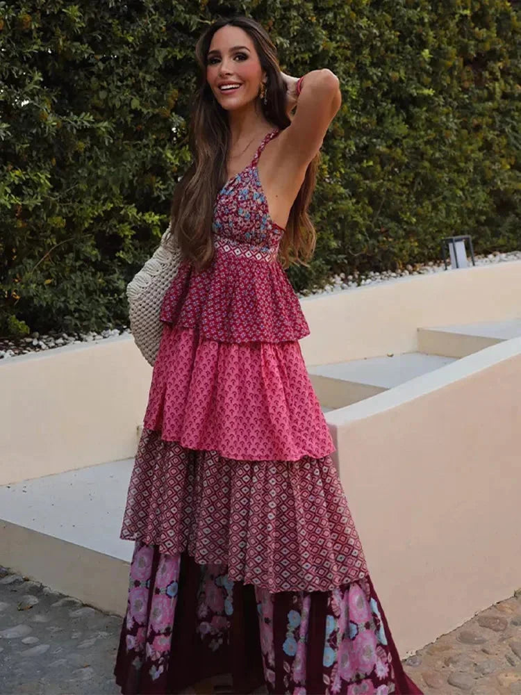 Women's sleeveless red maxi dress with multi-pattern tiers, made from lightweight fabric for a flowy, comfortable fit.