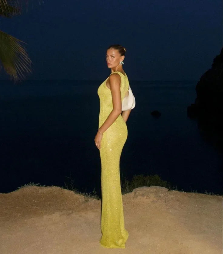 Women’s sleeveless shimmering fitted maxi dress in soft fabric, featuring a sleek silhouette and elegant shimmer for a…