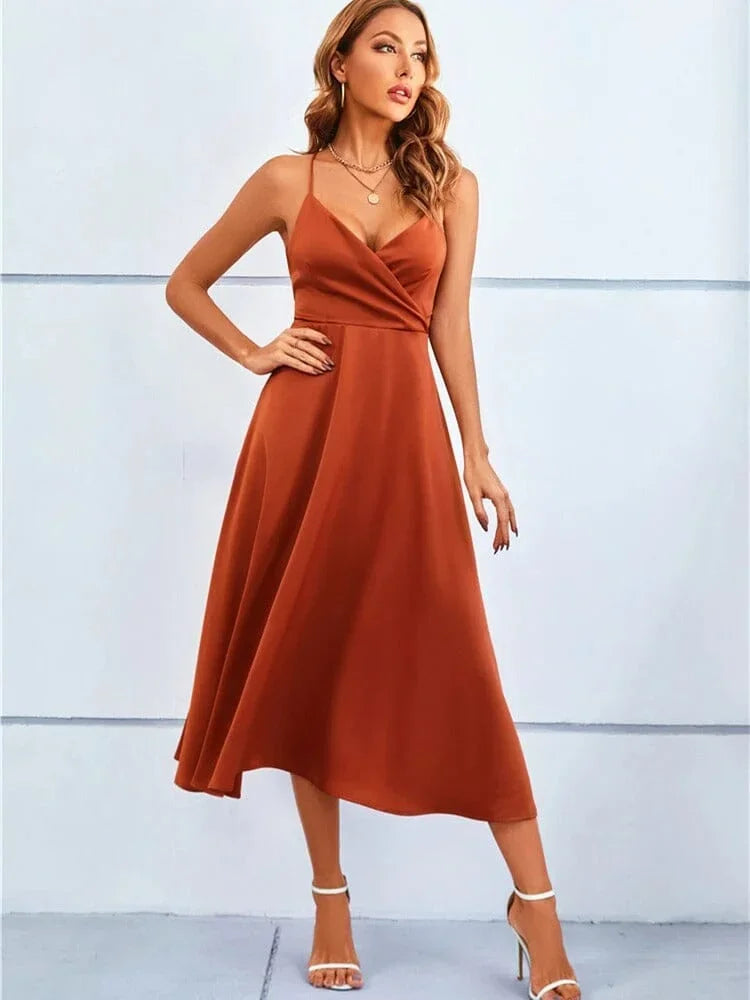 Women’s sleeveless silk midi dress featuring adjustable straps and a flowing silhouette for comfort and style.