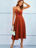 Light brown sleeveless silk midi dress with adjustable straps, featuring a flowy design and a smooth, elegant finish.