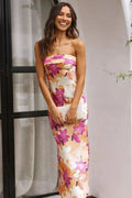 Light pink strapless maxi dress featuring a floral print, made from breathable fabric, perfect for warm-weather occasions.