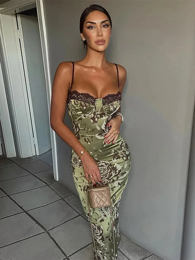 Green strapless floral print bodycon midi dress, made from stretchy fabric, featuring a fitted silhouette and elegant floral…