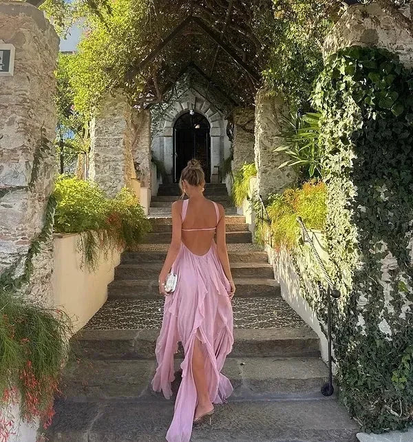 Women’s strapless maxi dress in lightweight fabric featuring flowing ruffle details for a graceful, effortless look.