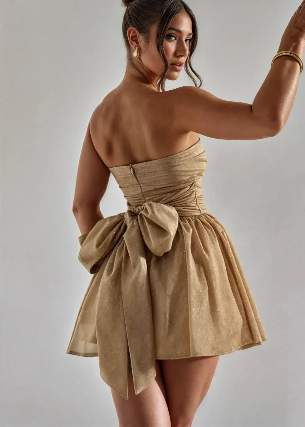 Women’s strapless mini dress crafted from soft cotton-blend fabric featuring an elegant bow detail at the front.