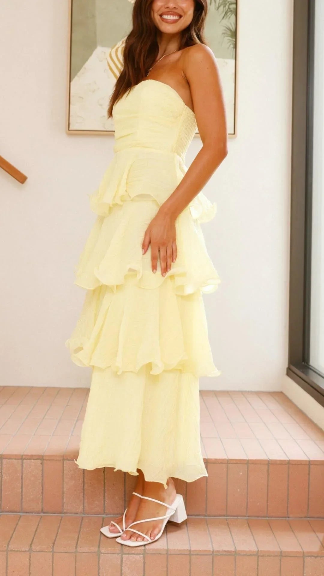 Women’s strapless tiered maxi dress in lightweight fabric, featuring delicate ruffles and a flowing silhouette for comfort.