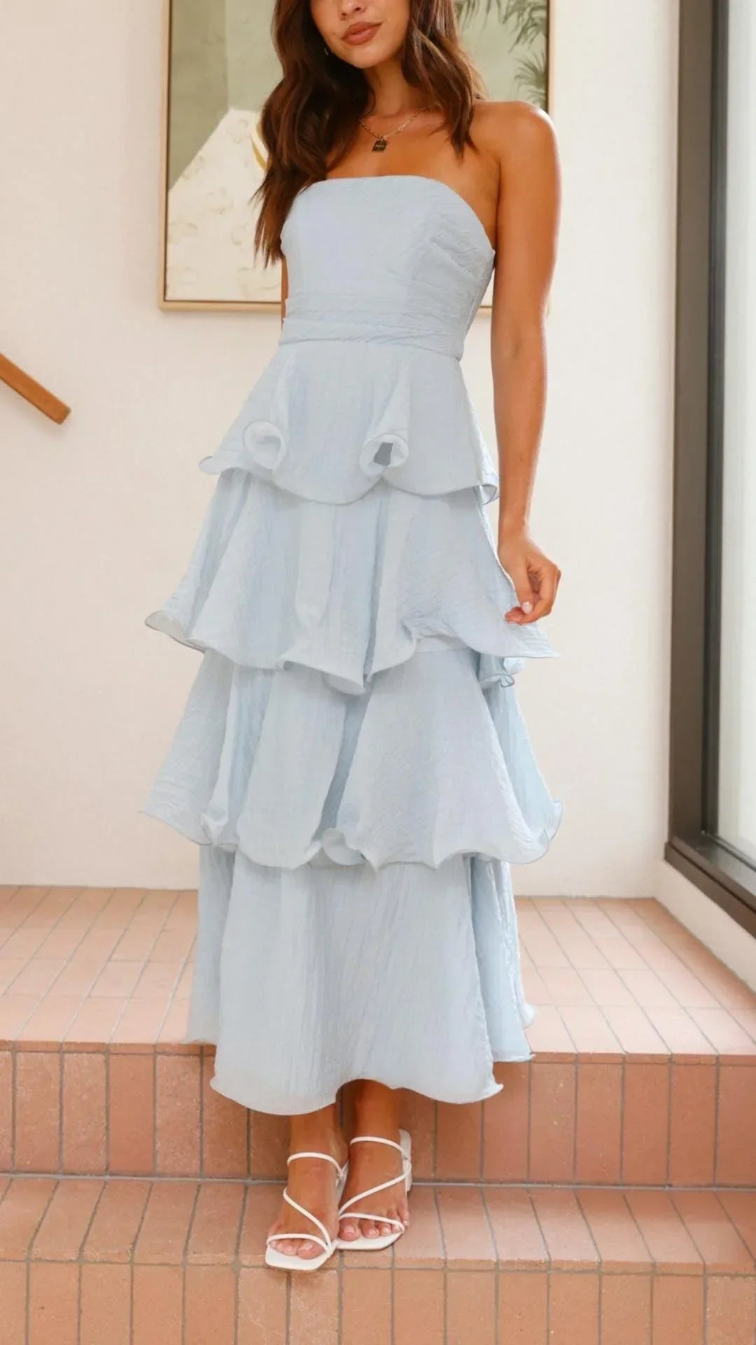 Women’s strapless tiered maxi dress featuring soft fabric, elegant ruffles, and a flowing silhouette perfect for warm…