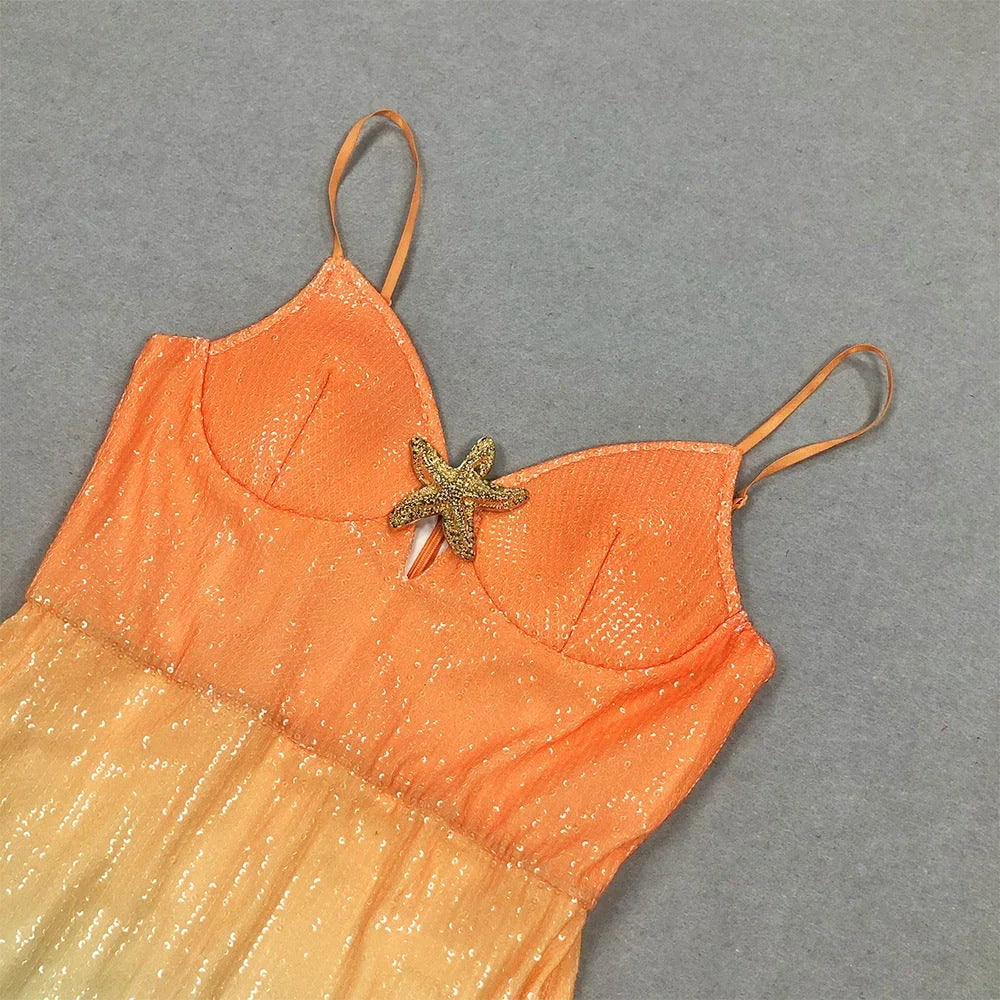 Women's sunset ombre midi dress featuring starfish accents, made from lightweight fabric with adjustable spaghetti straps.
