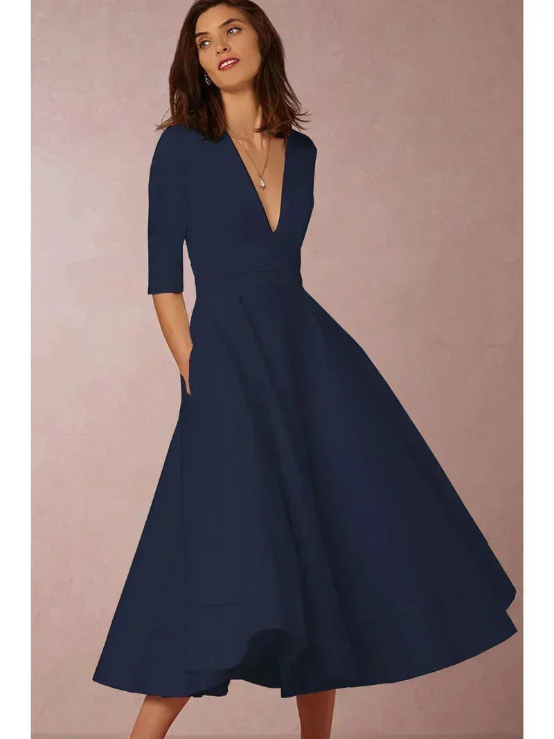 Navy blue women's tailored midi dress with a fitted bodice, v-neckline, and soft, breathable fabric for comfortable wear.