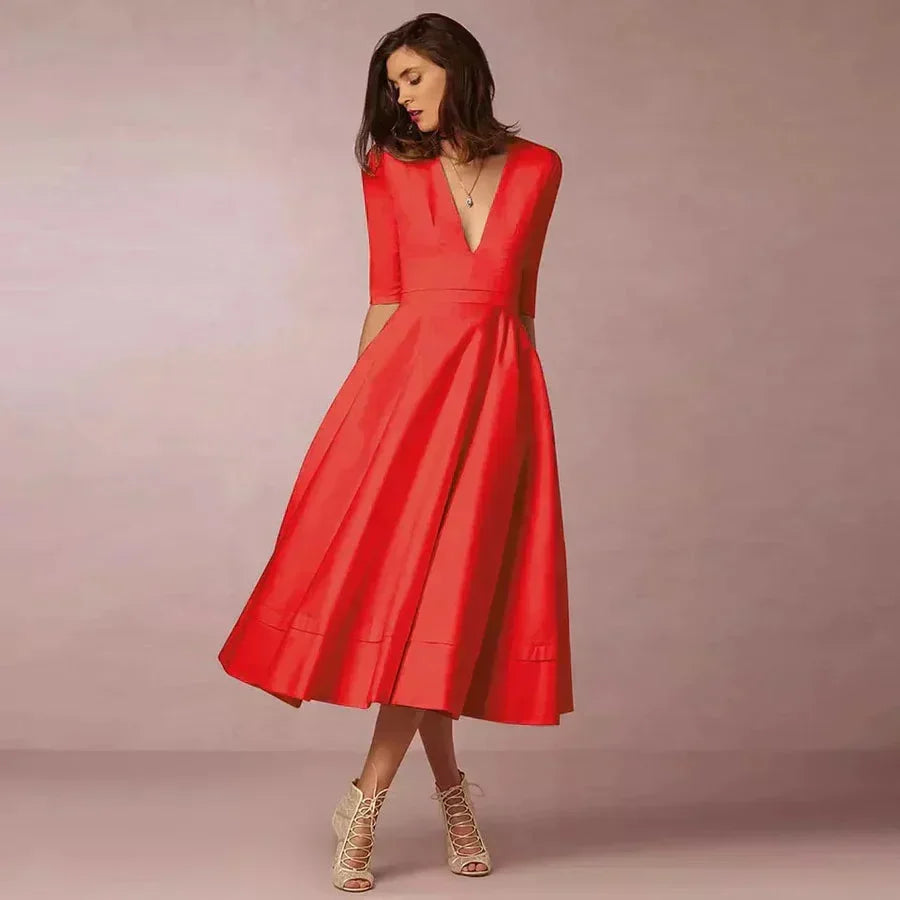 Red women's tailored midi dress featuring a fitted bodice and v-neckline, made from soft, breathable fabric for comfort.