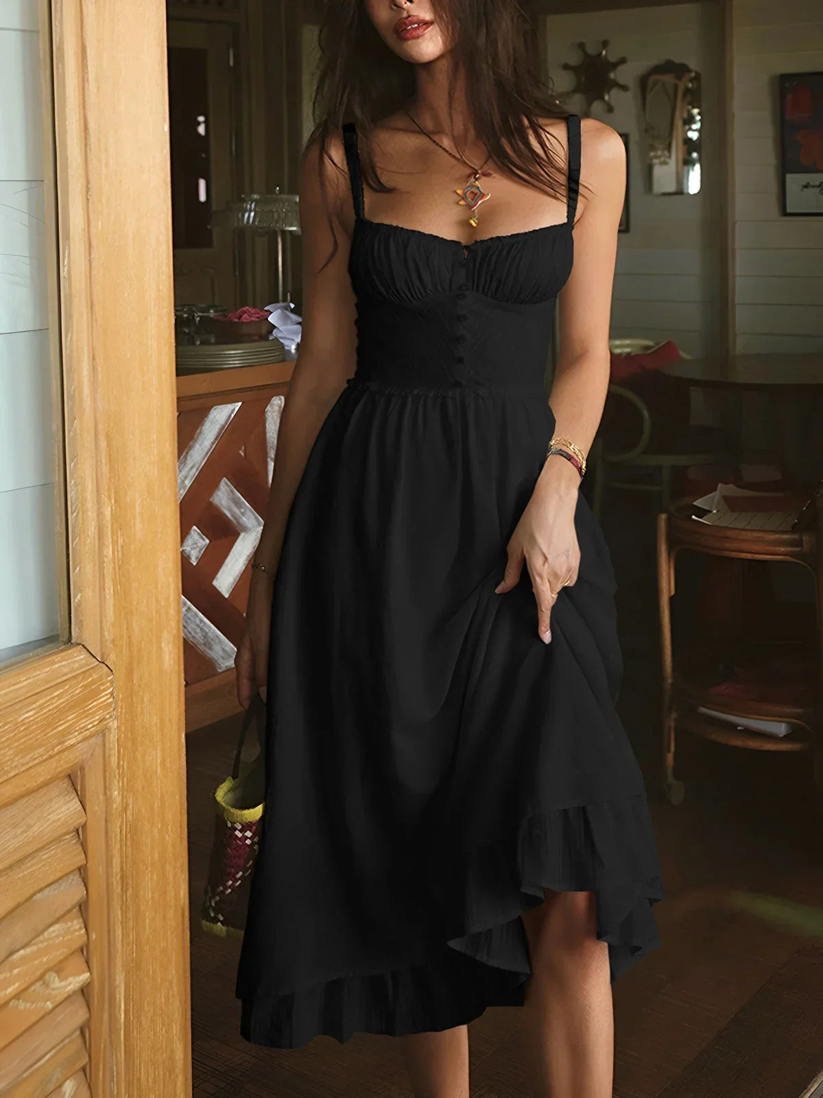 Black women’s tiered midi dress featuring ruching, adjustable straps, and lightweight fabric for comfort and versatility.