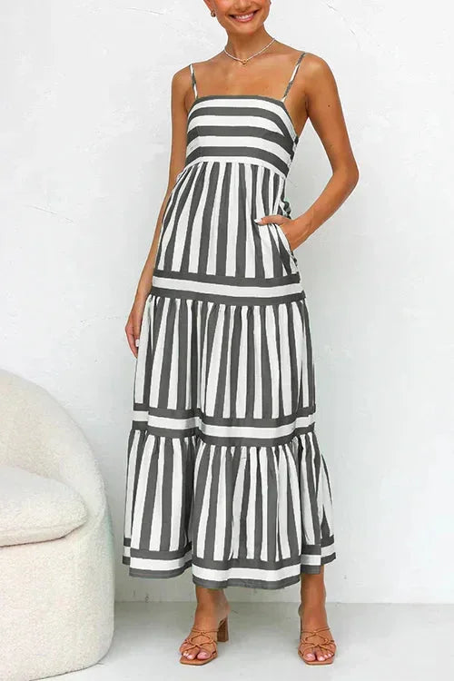 Women’s tiered midi dress featuring a strappy top, vertical stripes, and lightweight fabric for a comfortable fit.