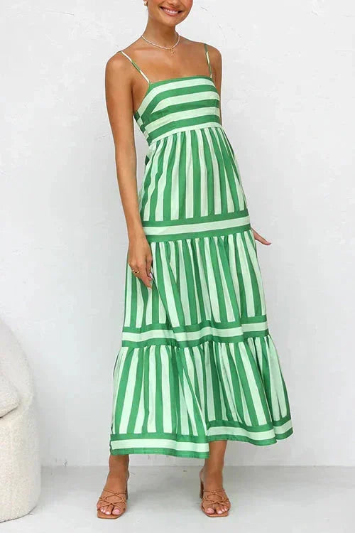 Green women's tiered midi dress with strappy top, made of lightweight fabric featuring vertical stripes for a flowy…