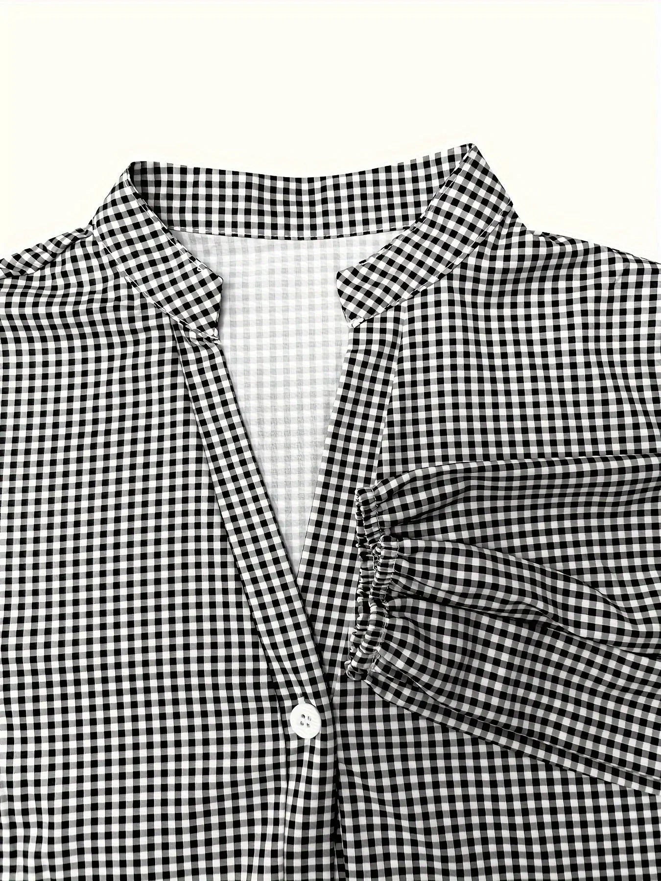 Women’s tiered mini dress in lightweight fabric, featuring button details and a stylish collar for a casual look.