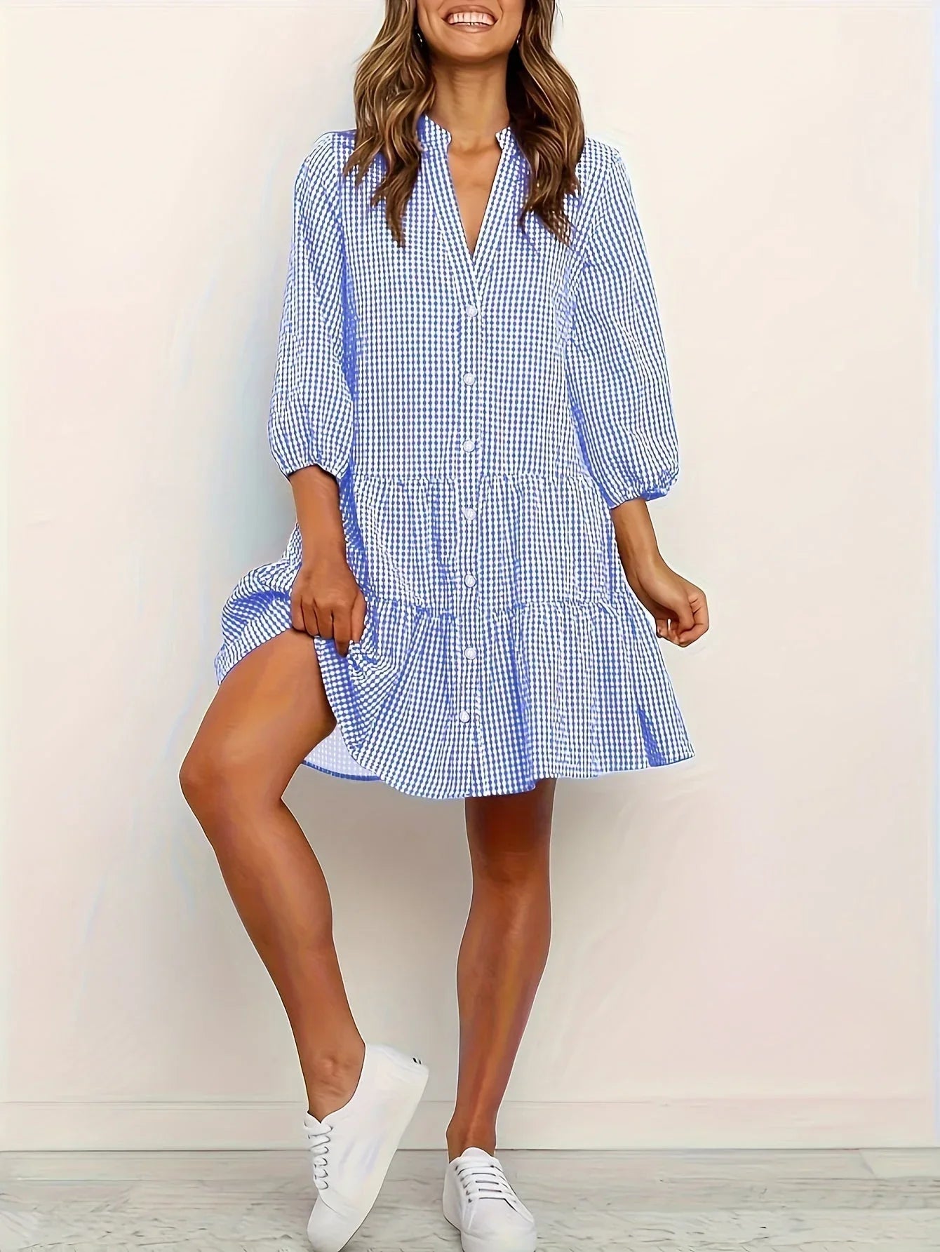 Blue women's tiered mini dress featuring button details and a collar, made from lightweight cotton fabric for comfort.