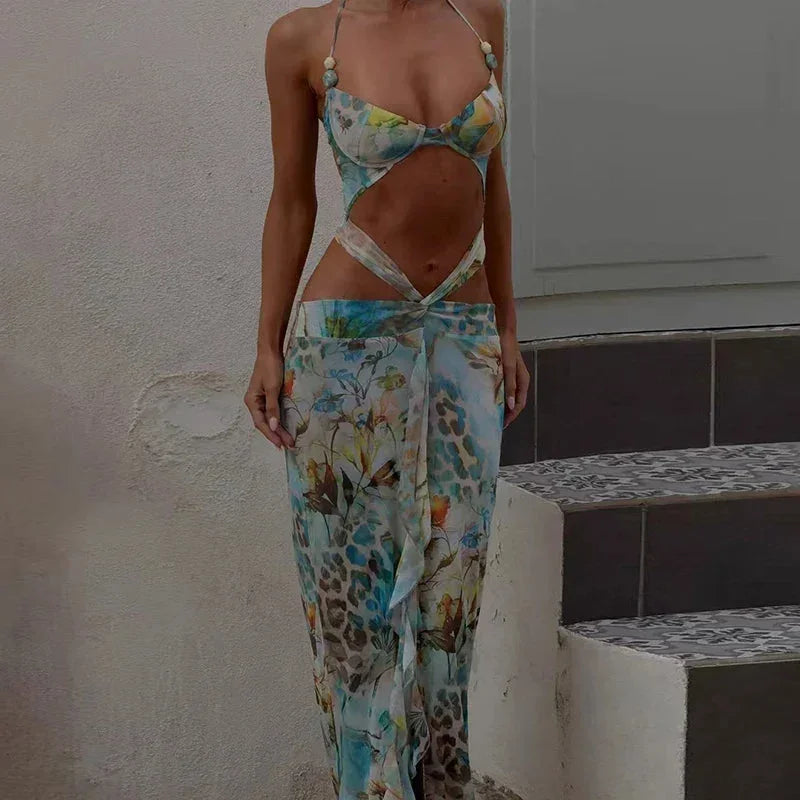 Women’s turquoise maxi dress featuring floral cutouts, crafted from lightweight fabric for summer comfort and style.