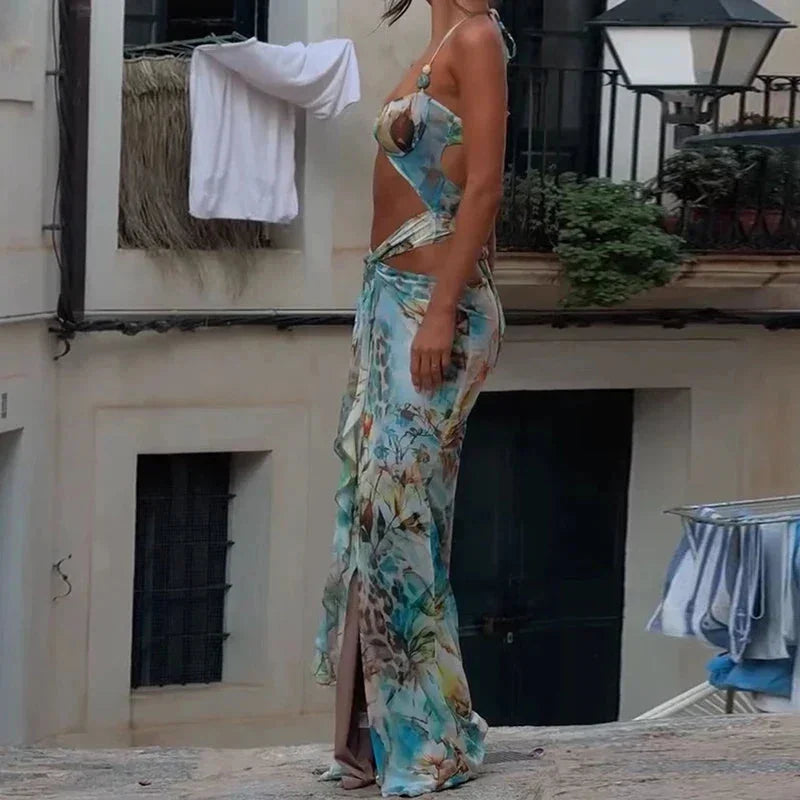 Turquoise maxi dress featuring floral patterns and cutout design, made from lightweight, breathable fabric for comfort.