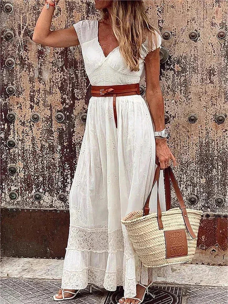 Women’s v-neck belted lace maxi dress with cap sleeves, featuring intricate lace detailing and a flattering silhouette.