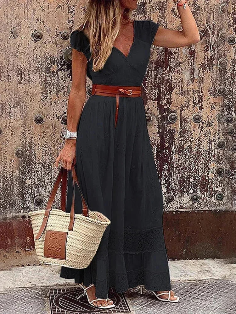 Women’s v-neck belted lace maxi dress with cap sleeves, featuring delicate lace overlay and a flattering silhouette.