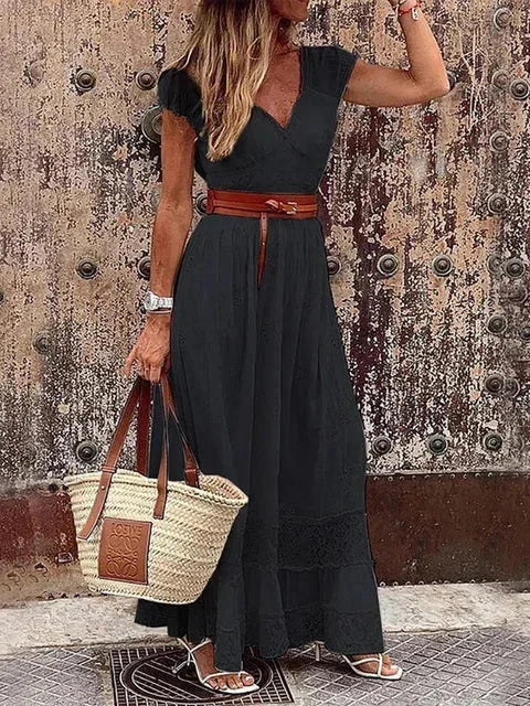 Black women's v-neck lace maxi dress with cap sleeves, featuring a belted waist for a flattering fit and elegant silhouette.