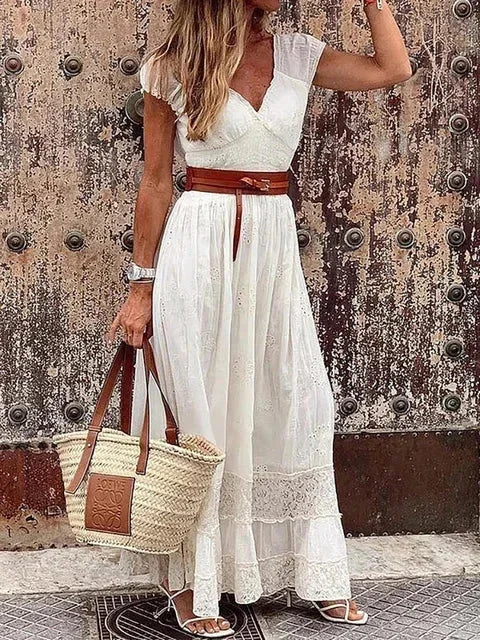 White women's v-neck lace maxi dress with cap sleeves and a belted waist, featuring delicate lace detailing and a flowing…
