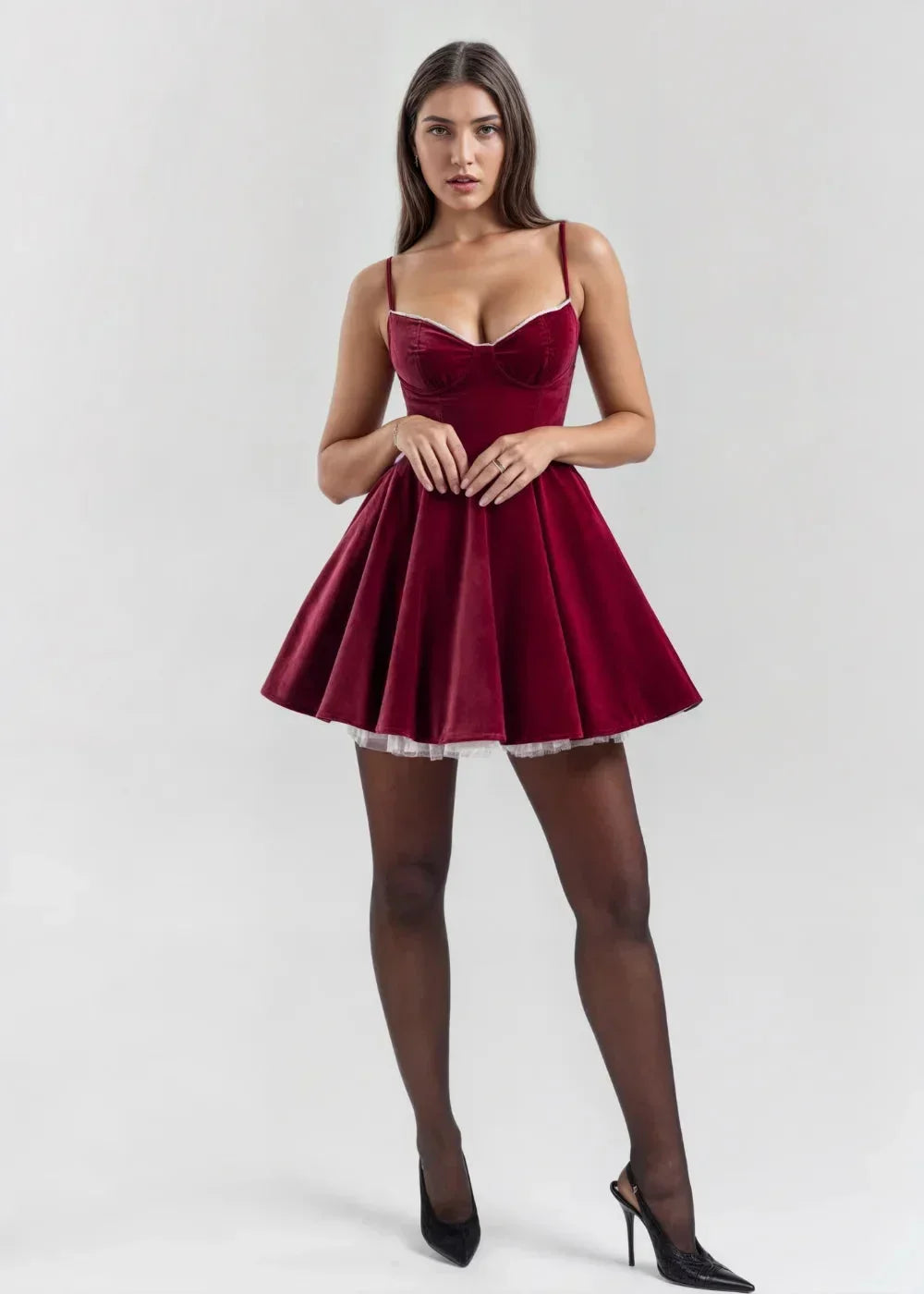 Women’s velvet mini dress featuring a fitted bodice and sheer detail for added elegance and a flattering silhouette.