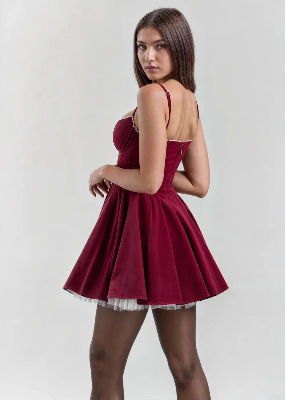 Women's velvet mini dress featuring a fitted bodice and sheer detail for a stylish touch. Ideal for various occasions.