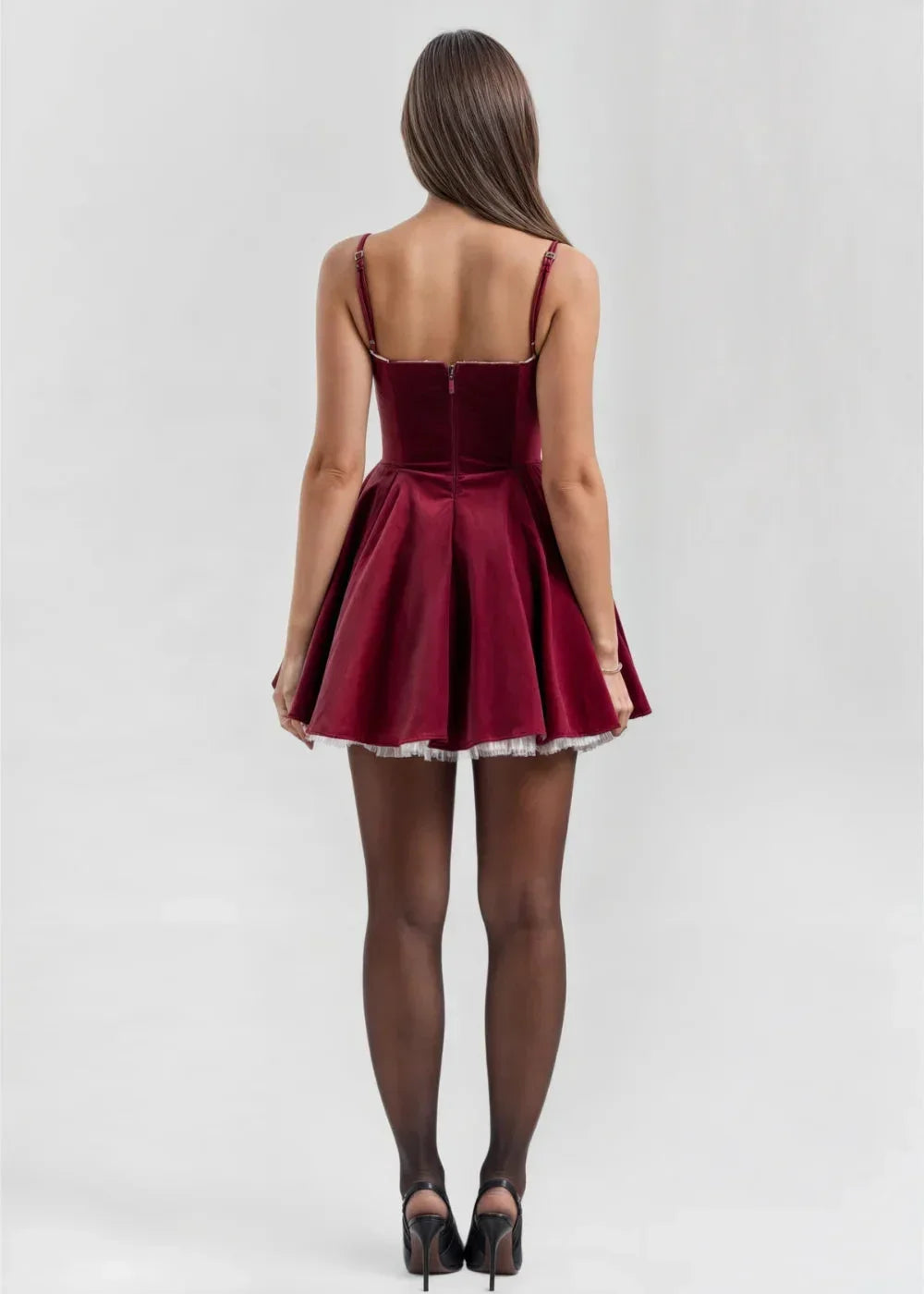 Women's velvet mini dress featuring a fitted bodice and sheer detail for an elegant and stylish look.