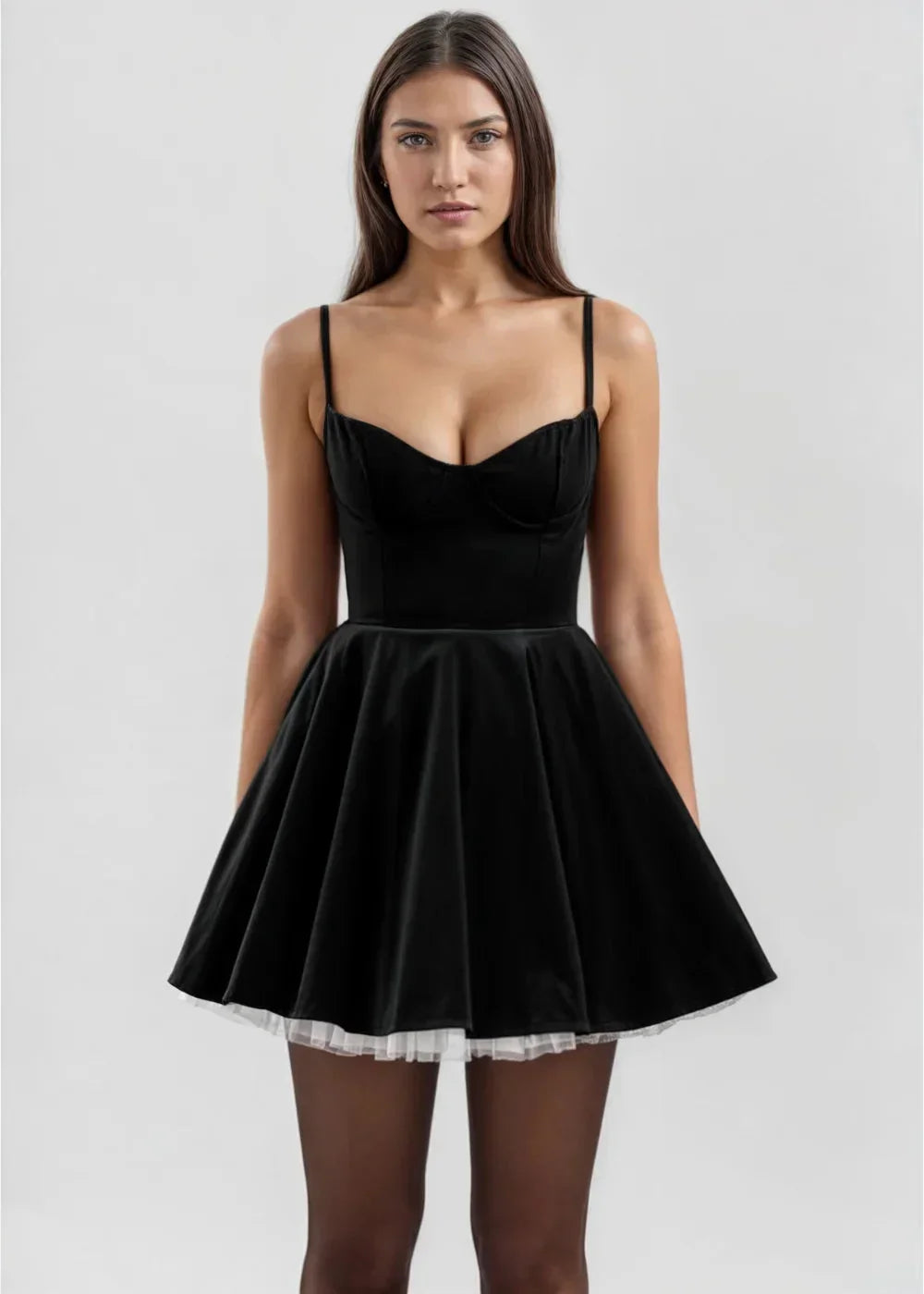Black women's velvet mini dress featuring a fitted bodice and sheer details for a stylish, textured look.