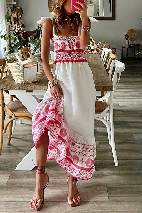 Women’s white maxi dress featuring pink tribal patterns, made from lightweight cotton, ideal for summer wear.