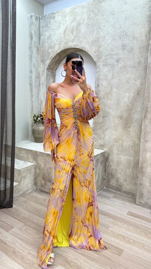 Women’s yellow pleated off-shoulder V-neck maxi dress made from soft, lightweight fabric, ideal for warm weather outings.