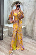 Women’s yellow pleated off-shoulder V-neck maxi dress made of lightweight fabric for comfortable wear during warm days.